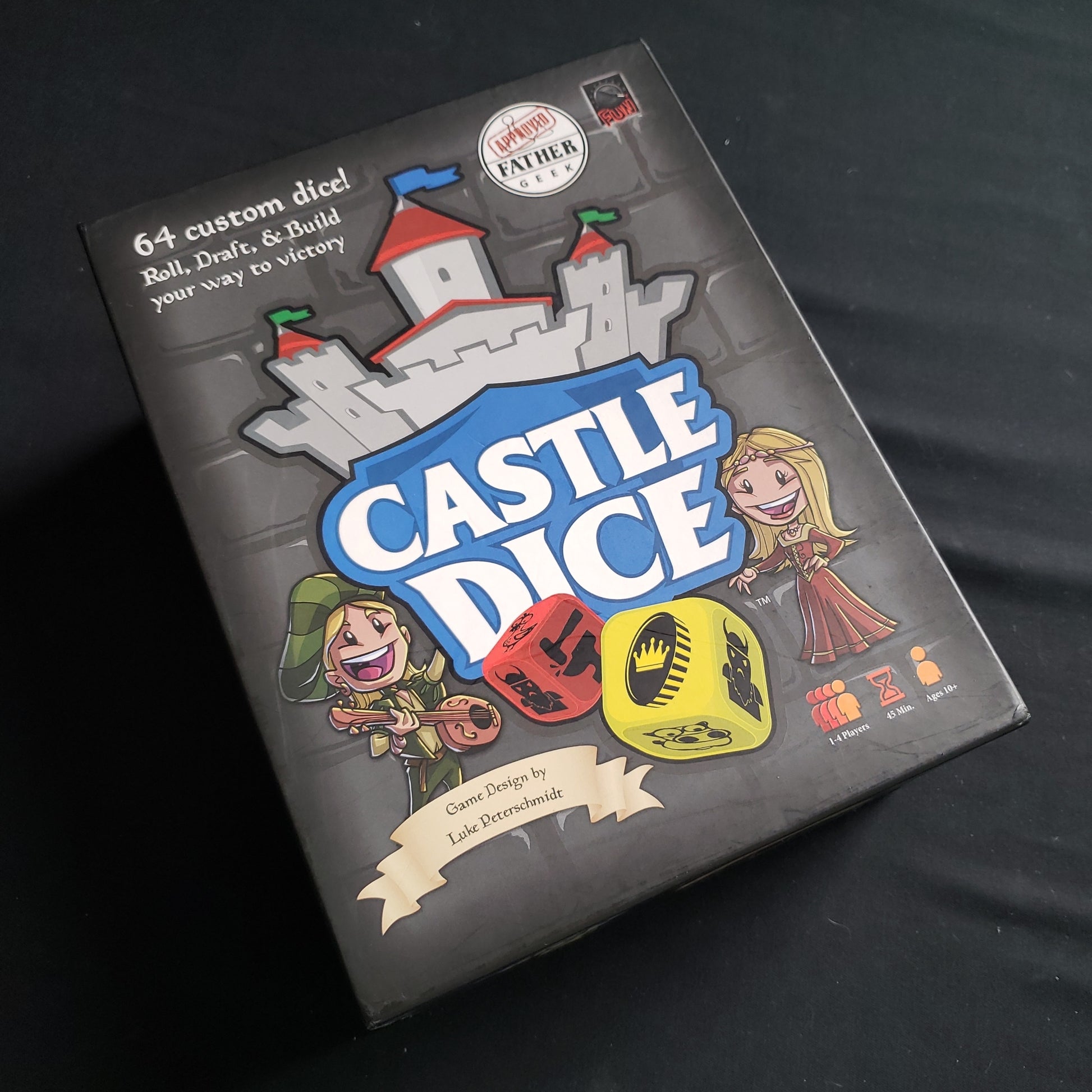 Image shows the front cover of the box of the Castle Dice board game