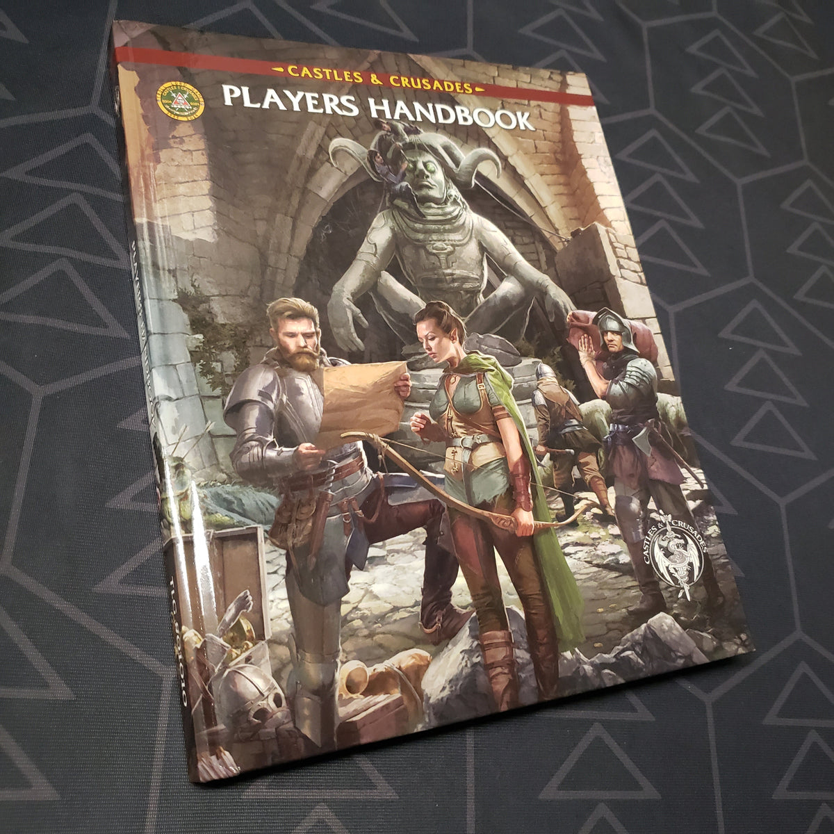 Image shows the front cover of the Players Handbook for the roleplaying game Castles & Crusades