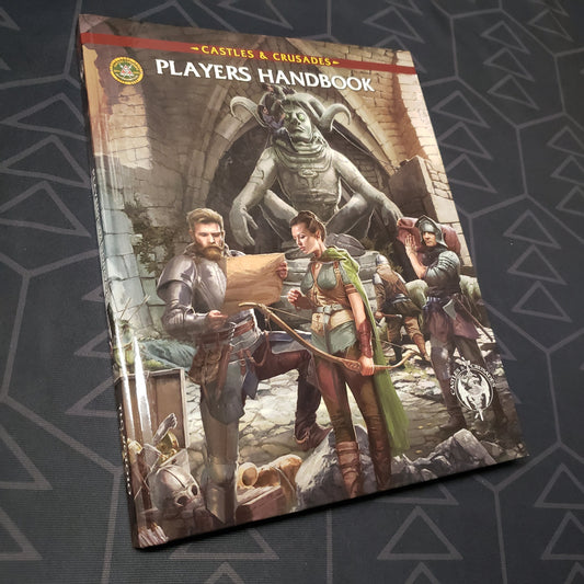 Image shows the front cover of the Players Handbook for the roleplaying game Castles & Crusades
