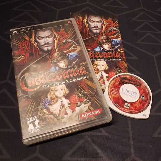 Image shows the case, manual and UMD disc for the video game Castlevania: The Dracula X Chronicles for Playstation Portable