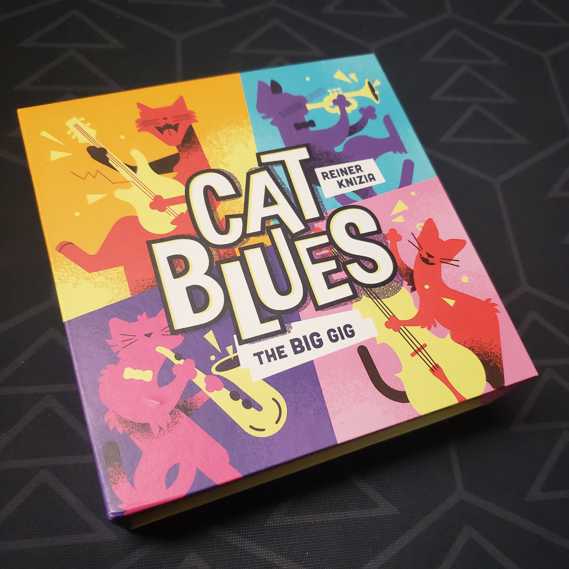 Image shows the front cover of the box for the Cat Blues: The Big Gig card game