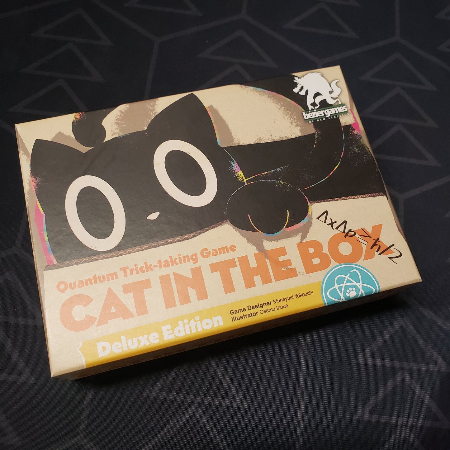 Image shows the front cover of the box of the Cat In The Box Deluxe edition card game