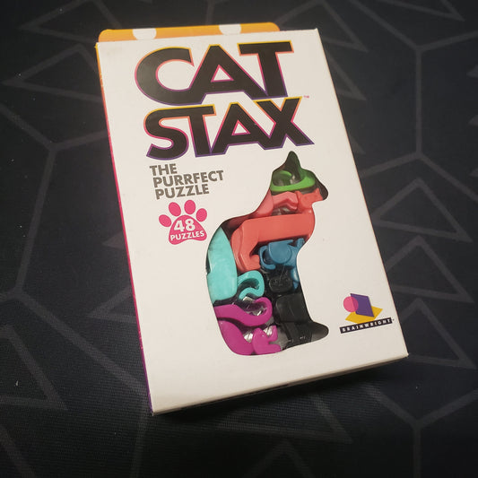 Image shows the front cover of the box for the Cat Stax puzzle game