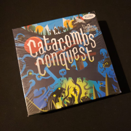 Image shows the front cover of the box of the Catacombs Conquest board game
