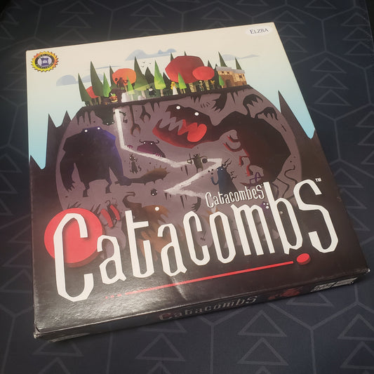 Image shows the front cover of the box of the Catacombs (Third Edition) board game