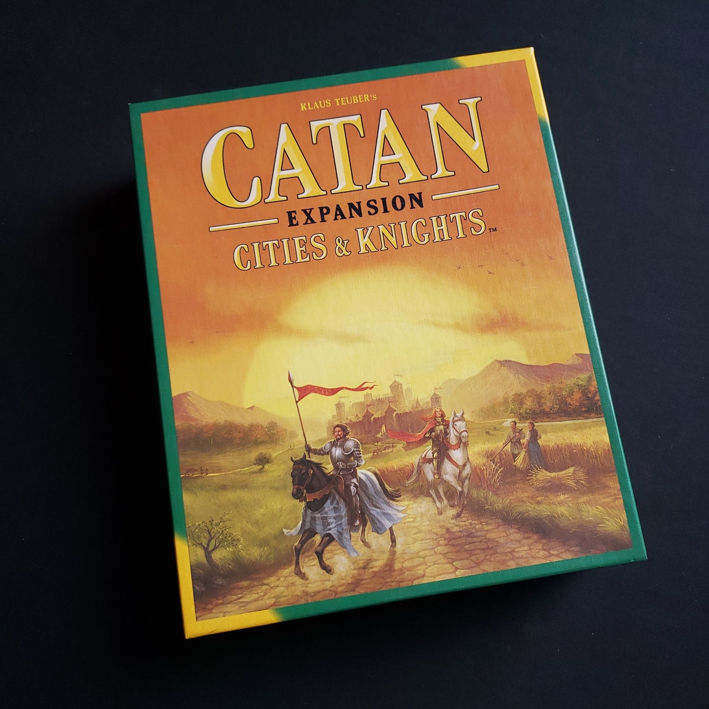 Image shows the front cover of the box of the Cities & Knights expansion for the Catan board game