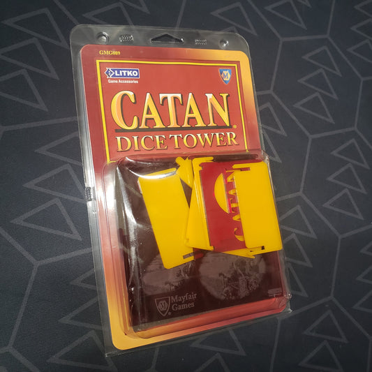 Image shows the front of the package for the official dice tower for the board game Catan