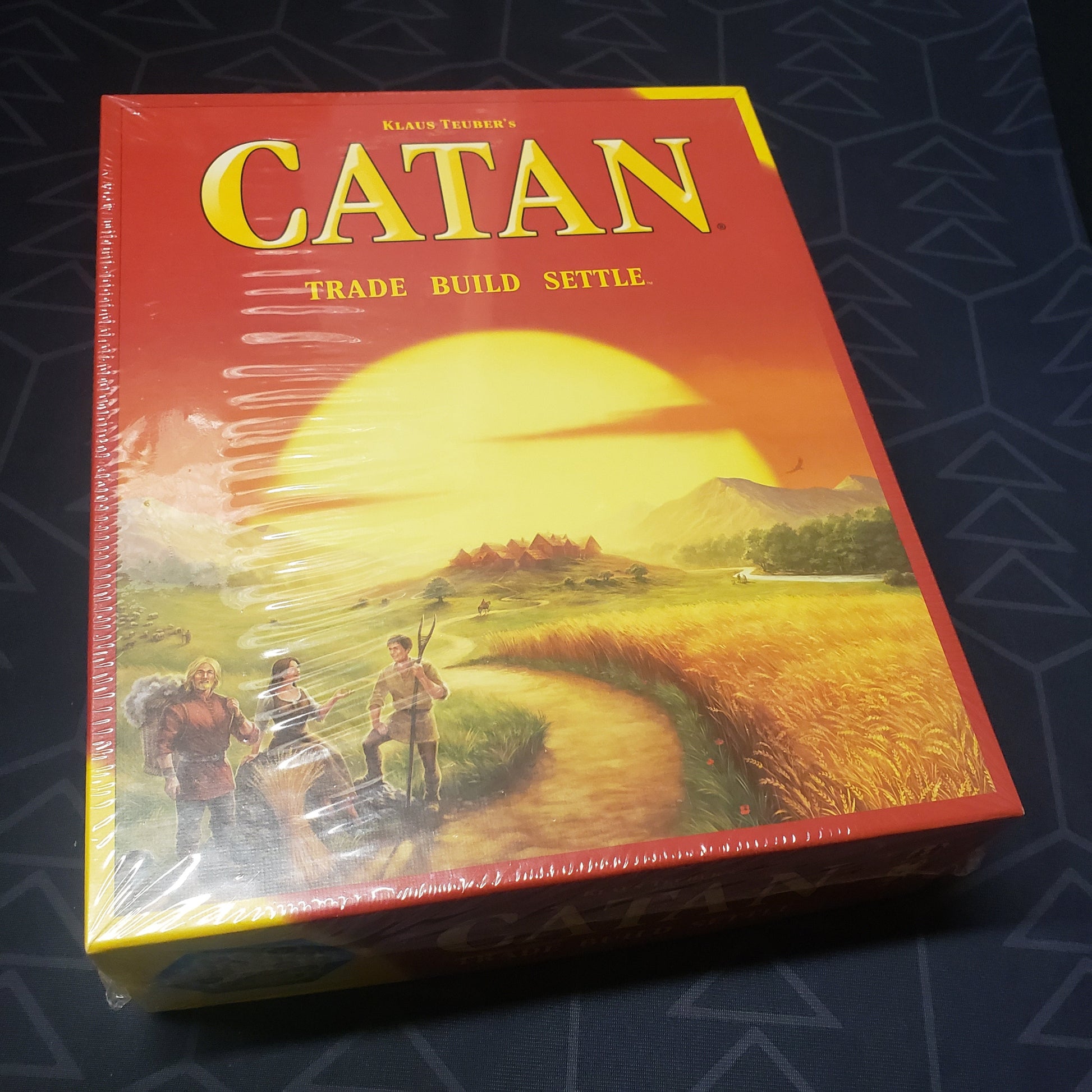 Image shows the front cover of the box of the Catan board game