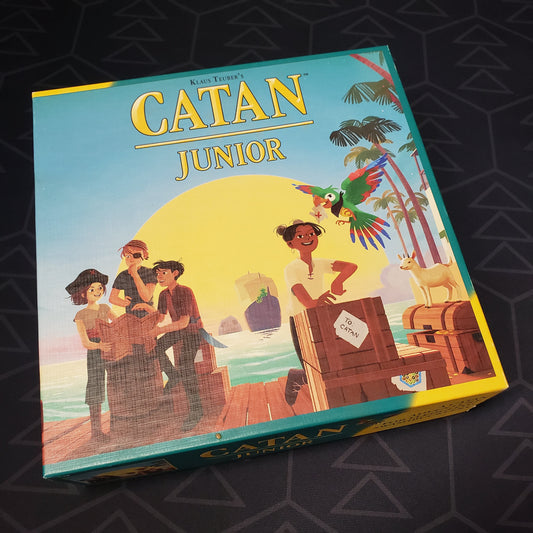 Image shows the front cover of the box of the Catan Junior board game