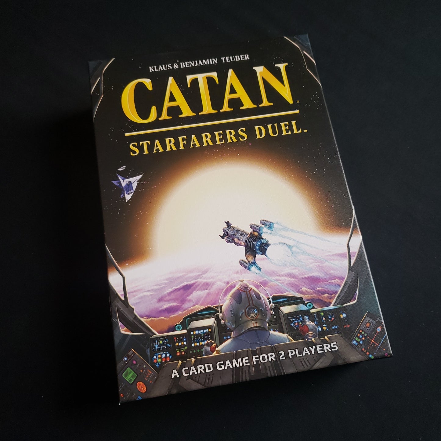 Image shows the front cover of the box of the Catan Starfarers Duel board game