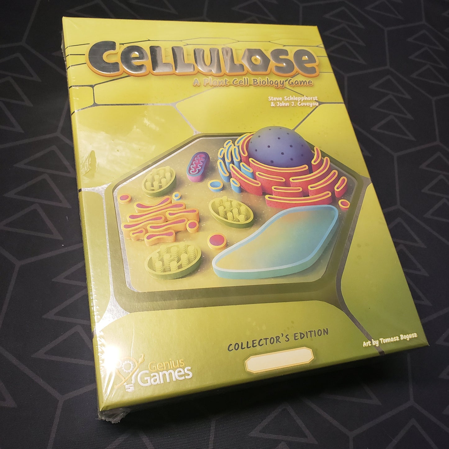 Image shows the front cover of the box for the Cellulose board game