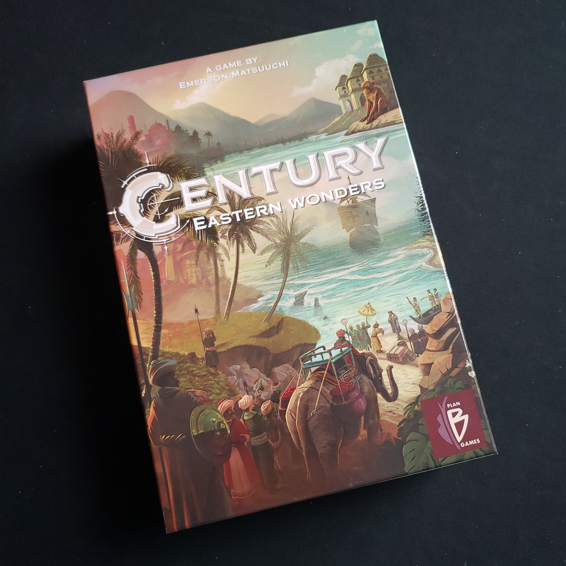 Image shows the front cover of the box of the Century: Eastern Wonders board game