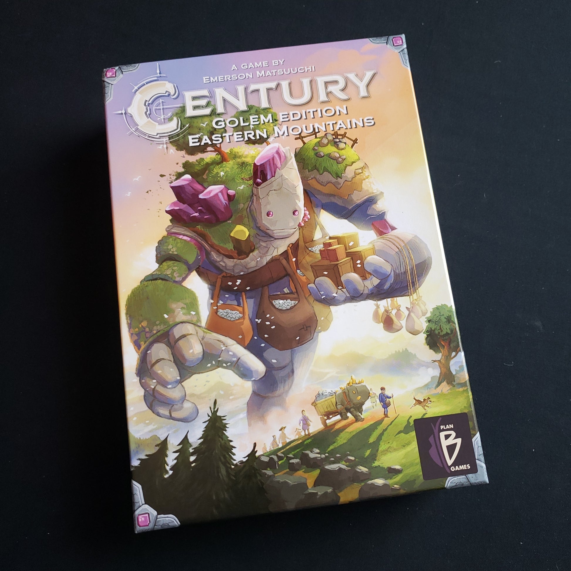 Image shows the front cover of the box of the Century: Golem Edition - Eastern Mountains board game