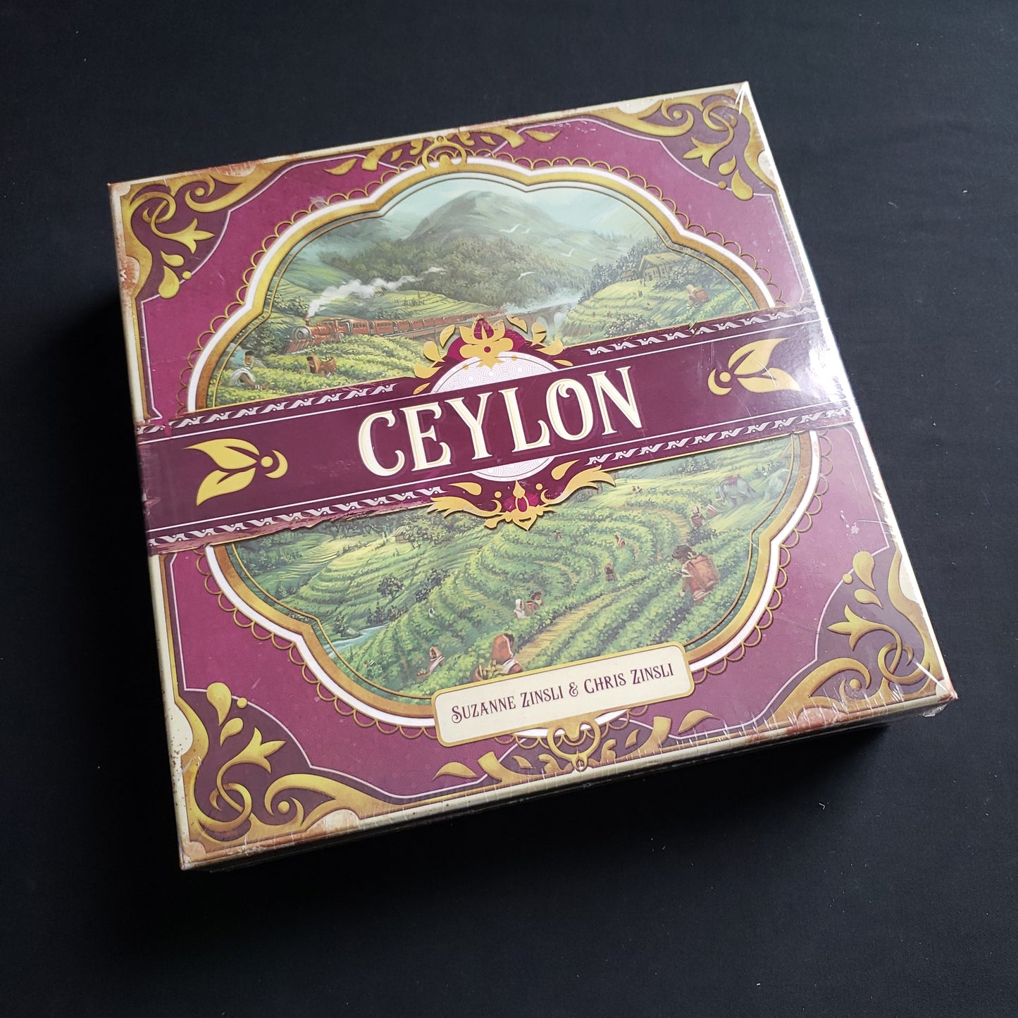 Image shows the front cover of the box of the Ceylon board game