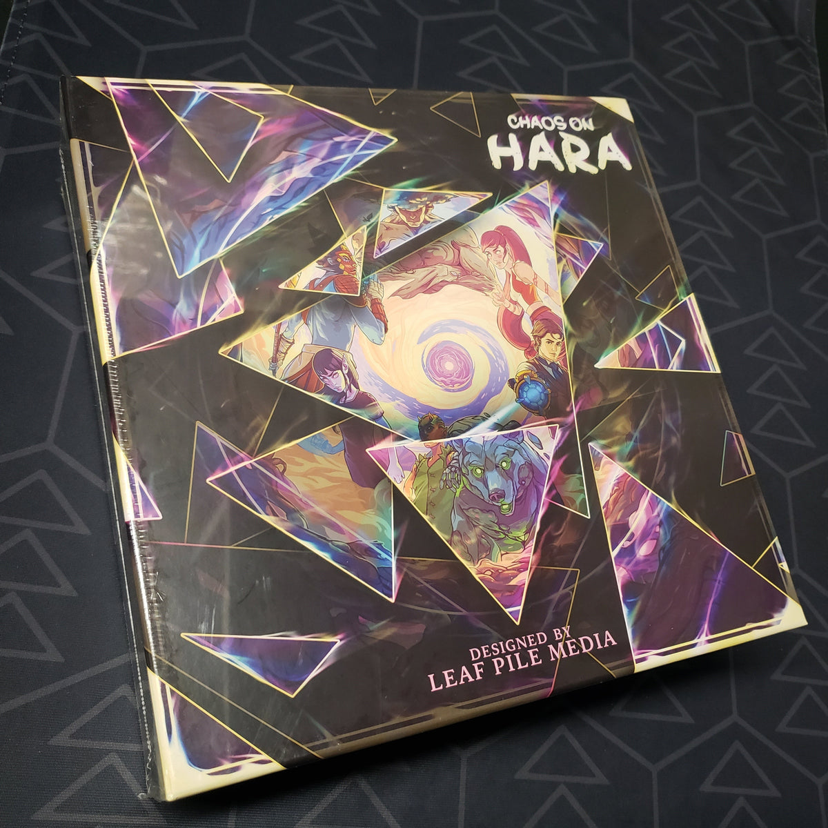 Image shows the front cover of the box of the Chaos on Hara expansion for the board game Champions of Hara