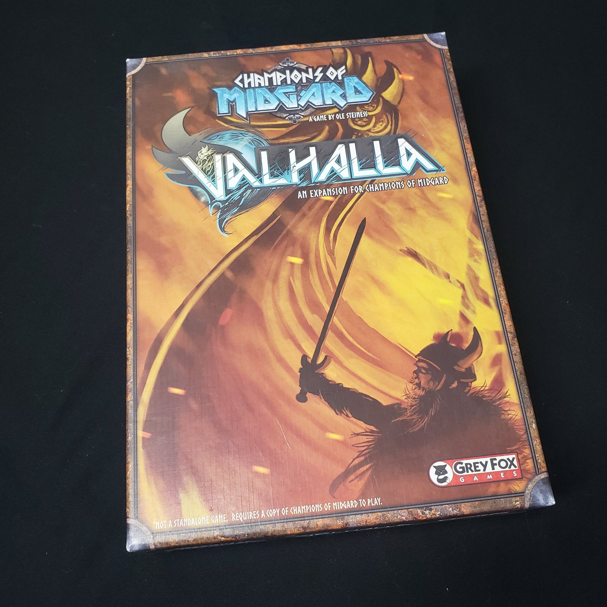 Image shows the front cover of the box of the Valhalla expansion for the board game Champions of Midgard