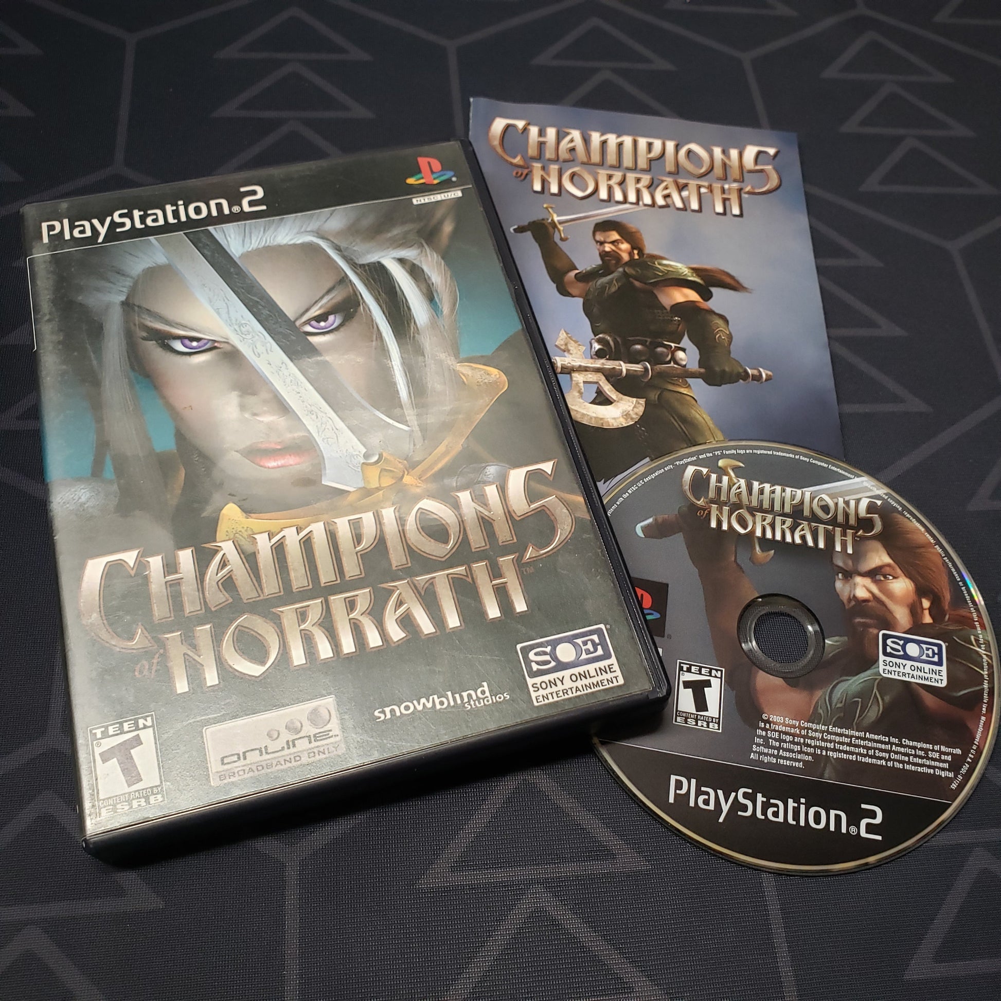 Image shows the case, manual and disc for the video game Champions of Norrath for Playstation 2