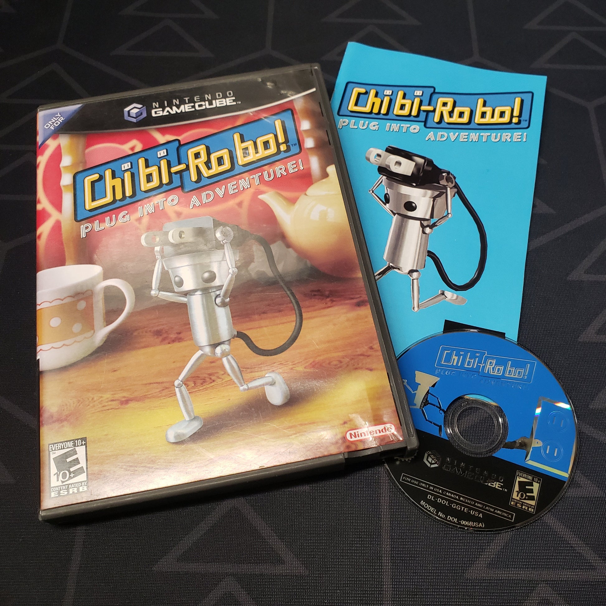 Image shows the case, manual and disc for the video game Chibi-Robo for Nintendo GameCube