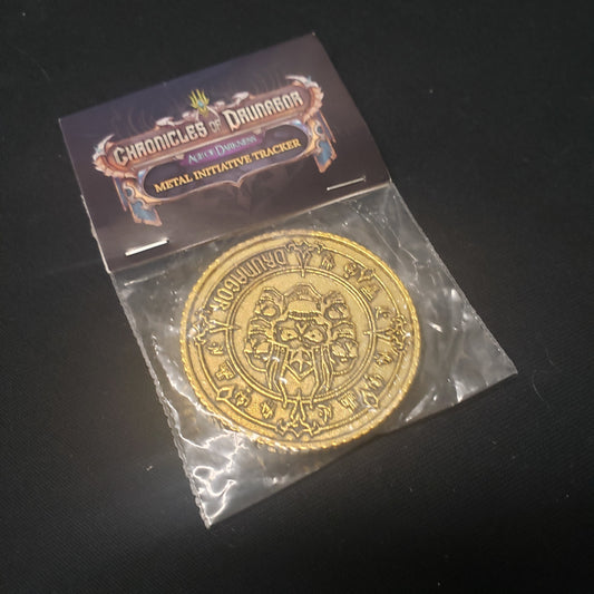 Image shows the front of the package of the metal Initiative Tracker for the board game Chronicles of Drunagor: Age of Darkness