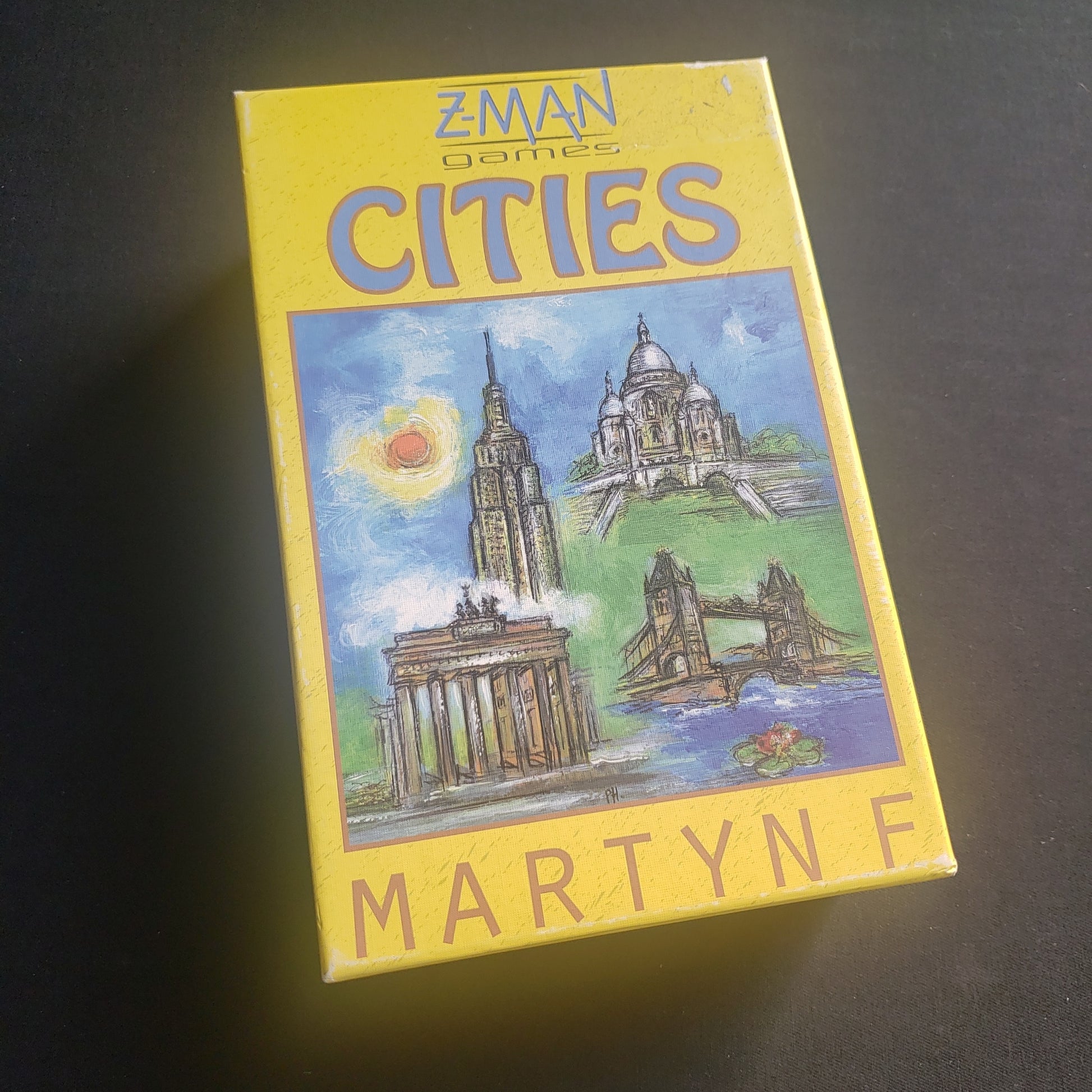 Image shows the front cover of the box of the Cities board game