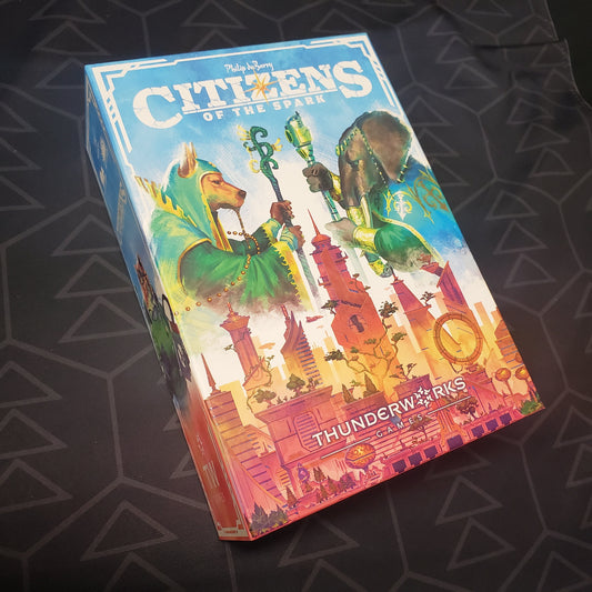 Image shows the front cover of the box for the Citizens of the Spark board game