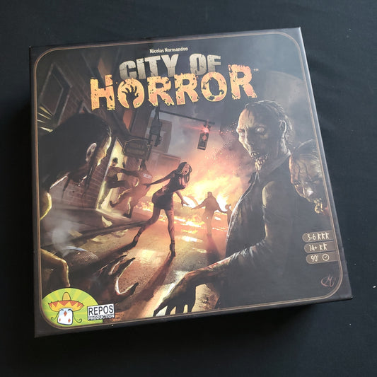 Image shows the front cover of the box of the City of Horror board game