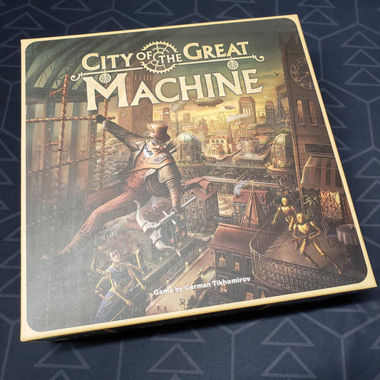 Image shows the front cover of the box for the City of the Great Machine board game