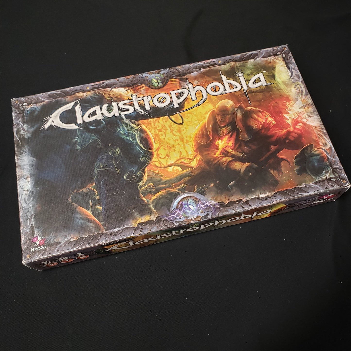 Image shows the front cover of the box of the Claustrophobia board game