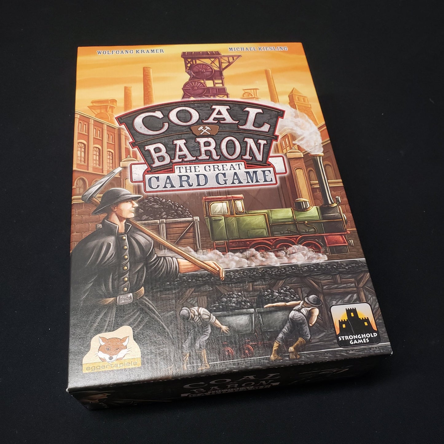 Image shows the front cover of the box of Coal Baron: The Great Card Game