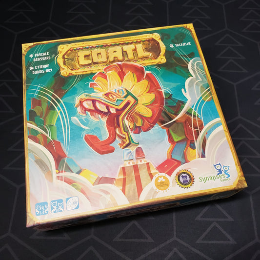 Image shows the front cover of the box of the Coatl board game
