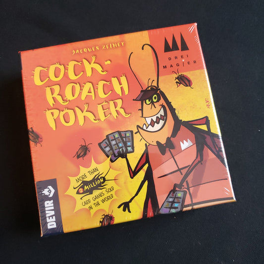 Image shows the front cover of the box of the Cockroach Poker card game