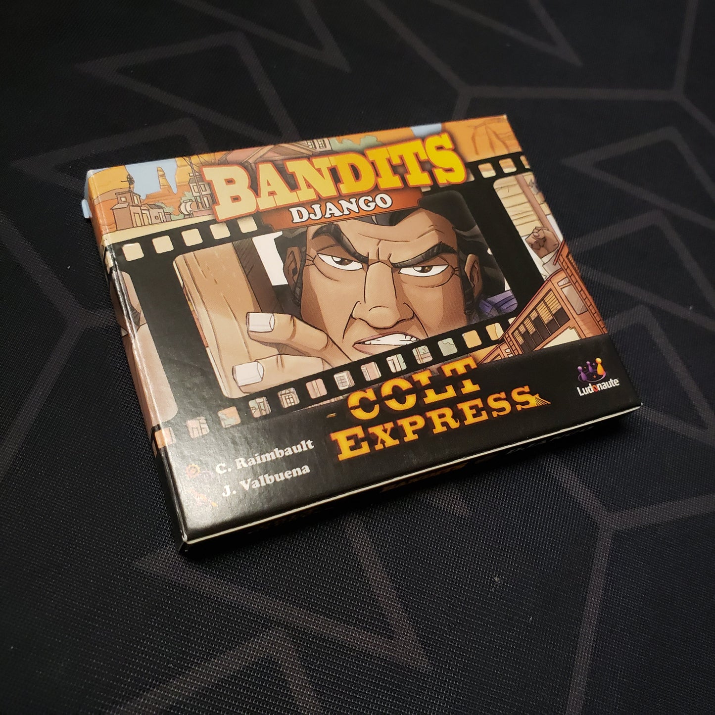Image shows the front cover of the box of the Bandits: Django expansion for the board game Colt Express