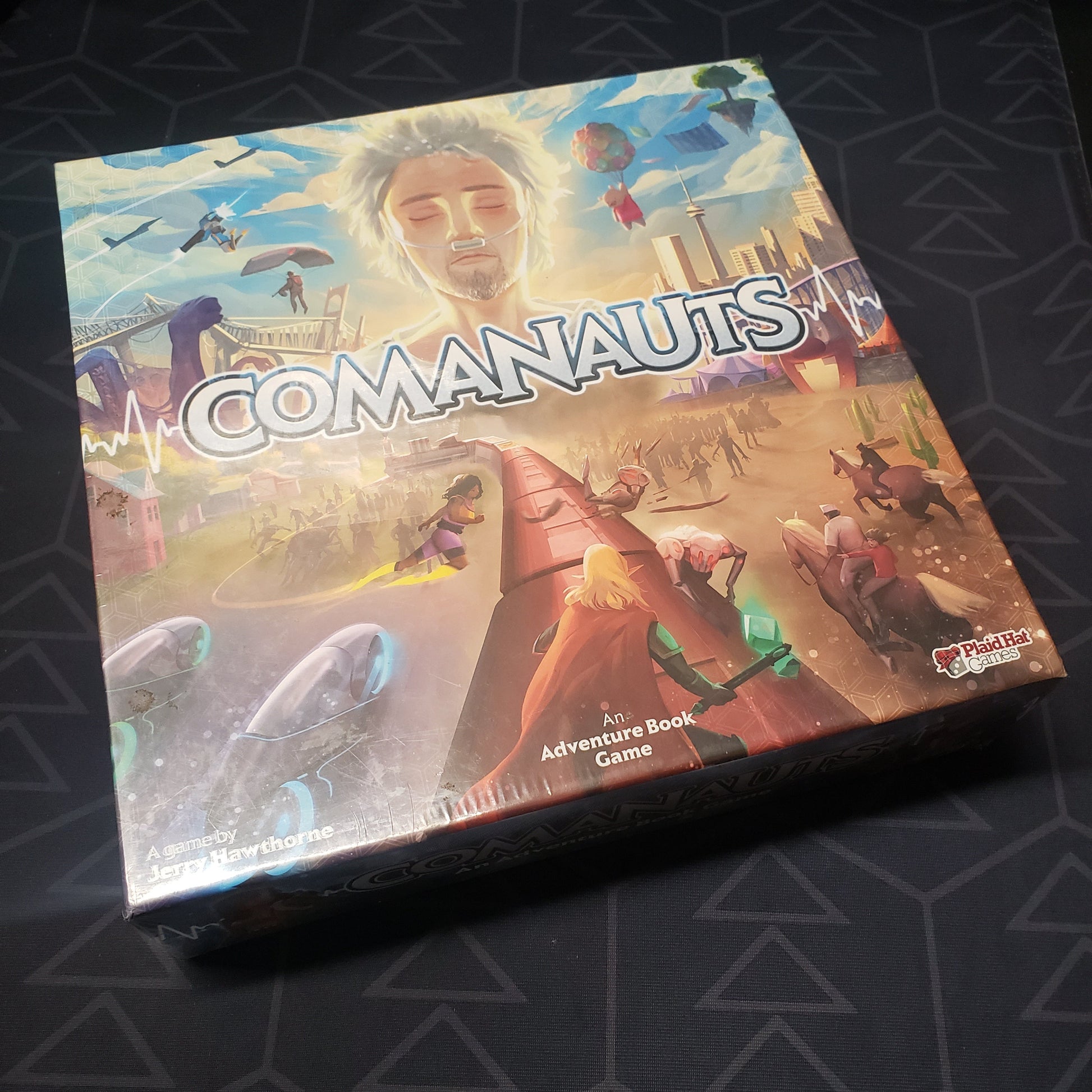 Image shows the front cover of the box of the Comanauts board game