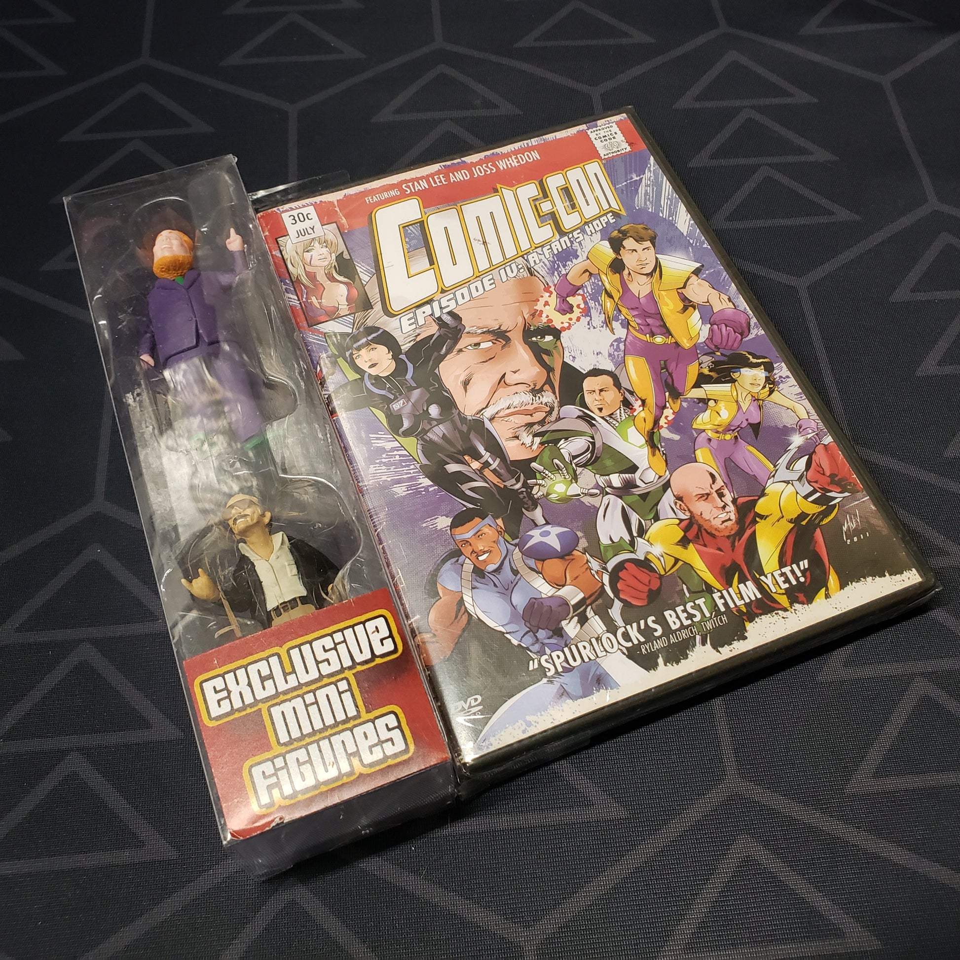 Image shows the front of the case & mini figure pack for the movie Comic-Con: Episode IV - A Fan's Hope on DVD