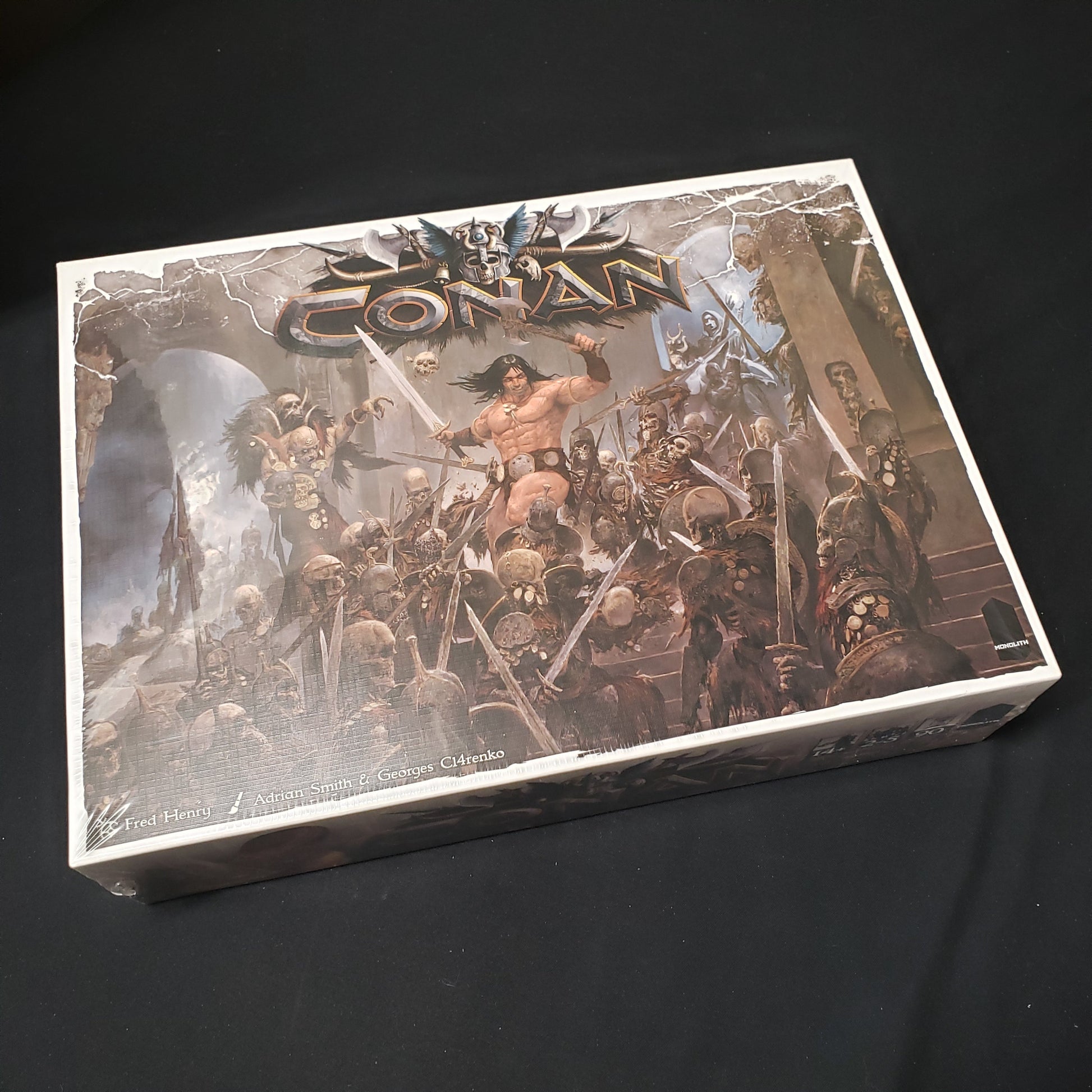 Image shows the front of the box of the board game Conan