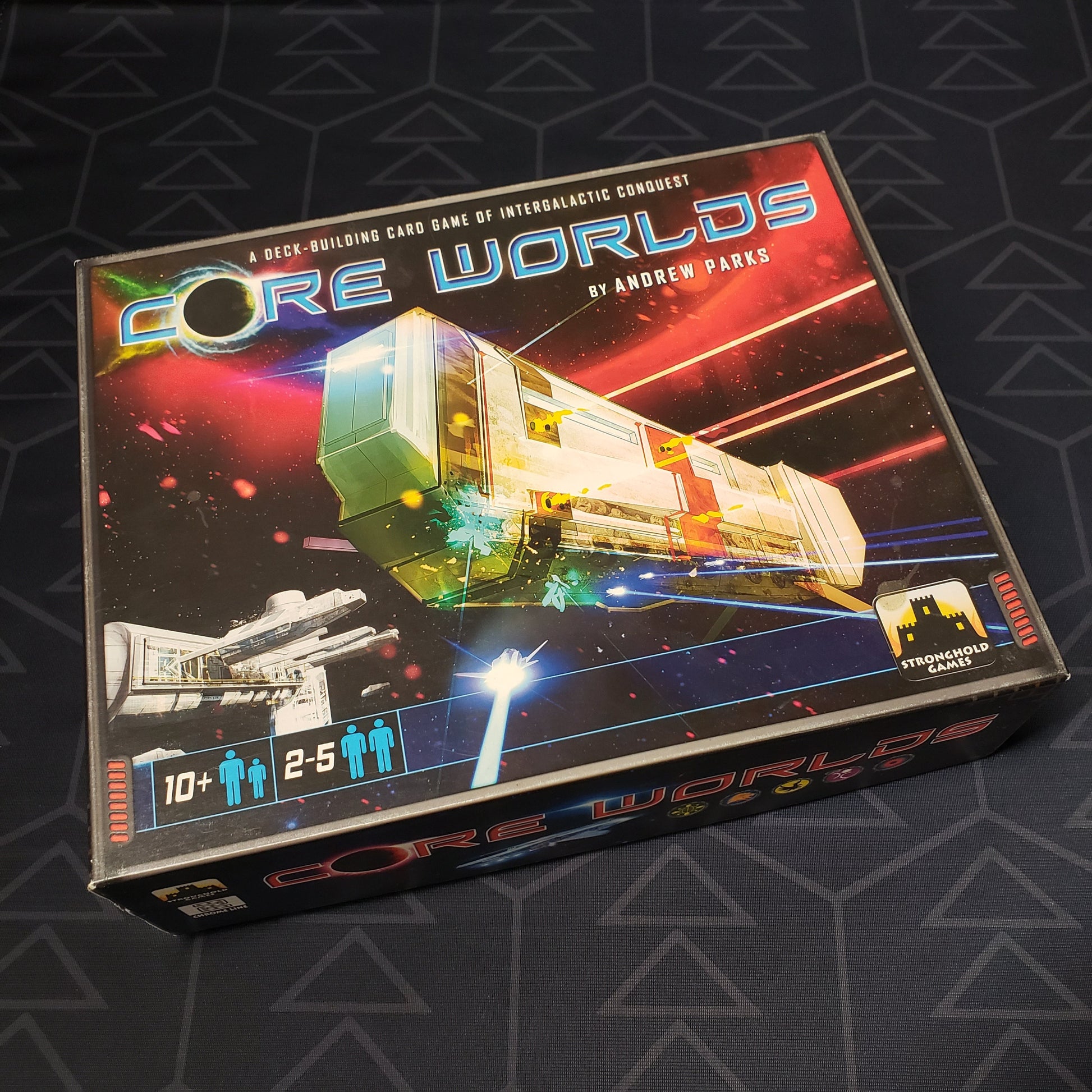 Image shows the front cover of the box of the Core Worlds card game