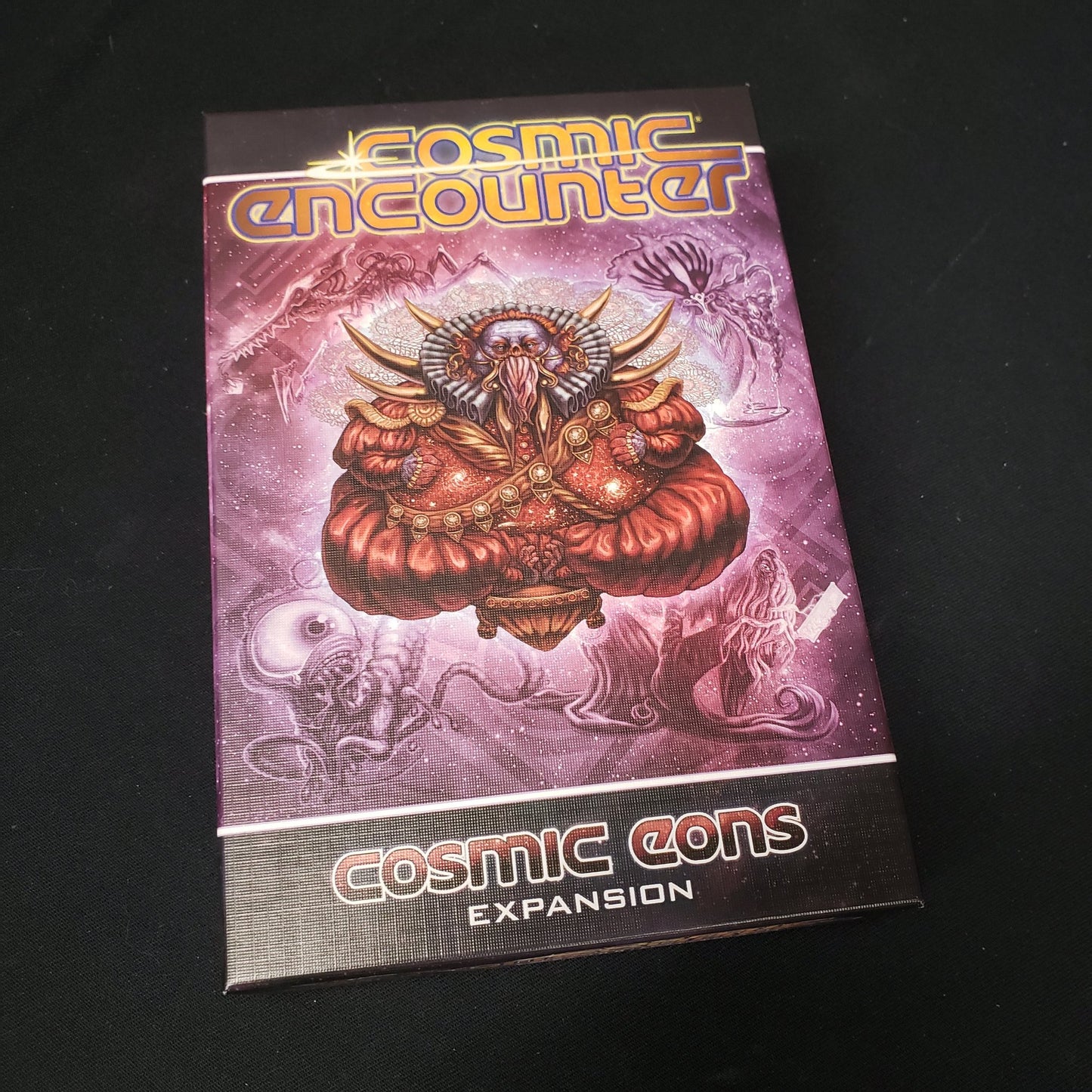 Image shows the front cover of the box for the Cosmic Eons expansion from the board game Cosmic Encounter