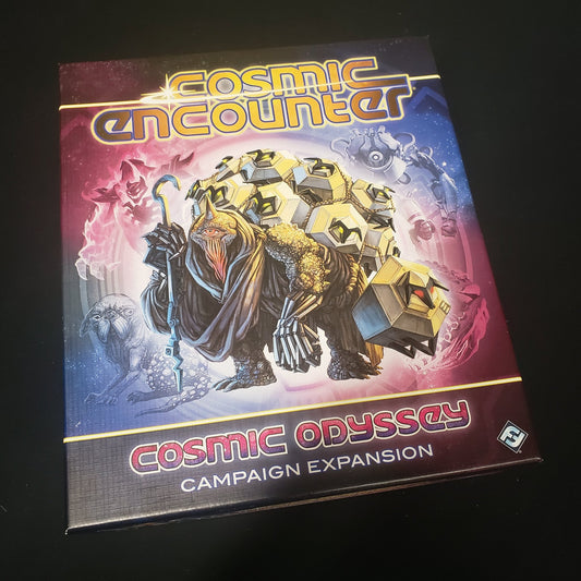 Image shows the front cover of the box for the Cosmic Odyssey expansion from the board game Cosmic Encounter