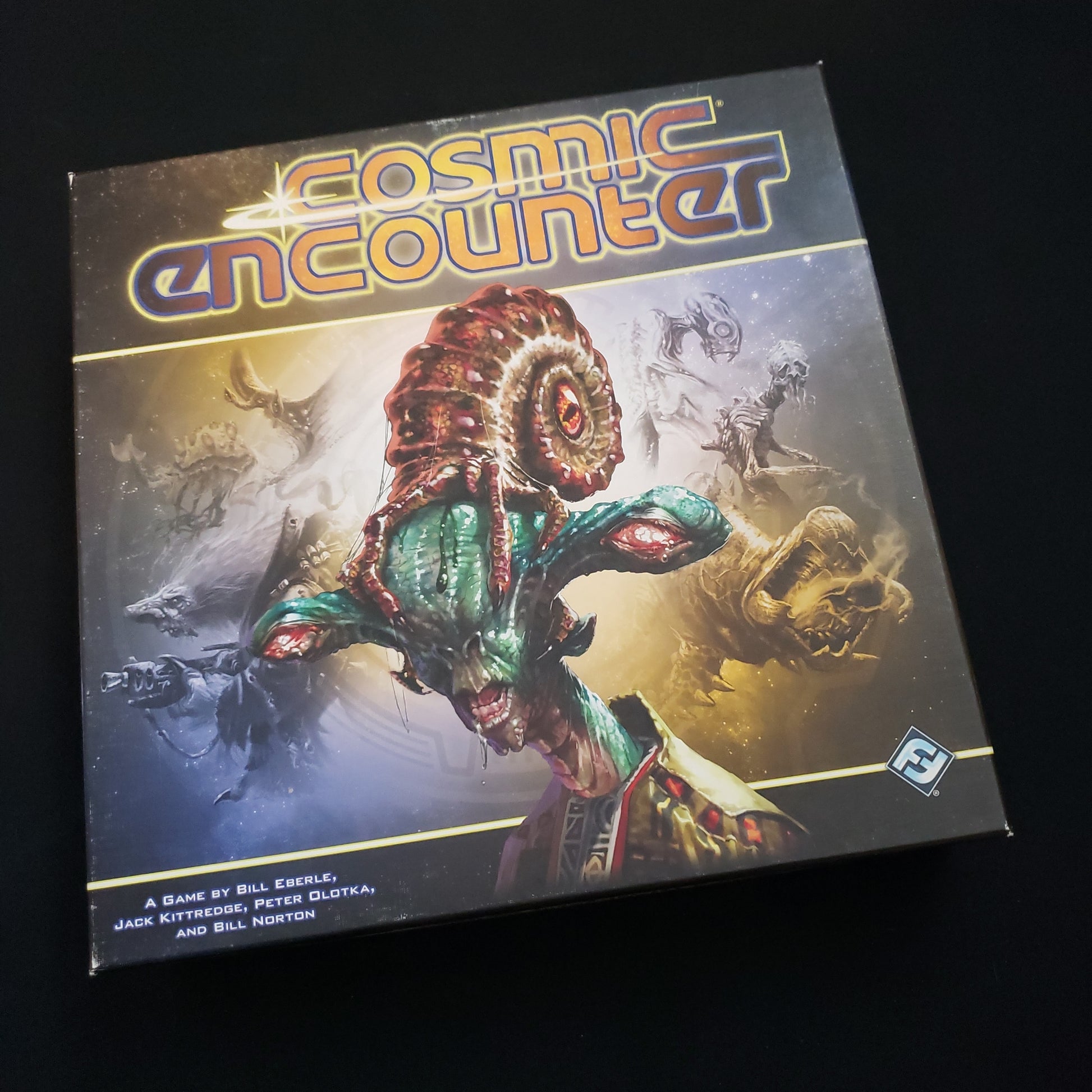 Image shows the front cover of the box of the Cosmic Encounter board game