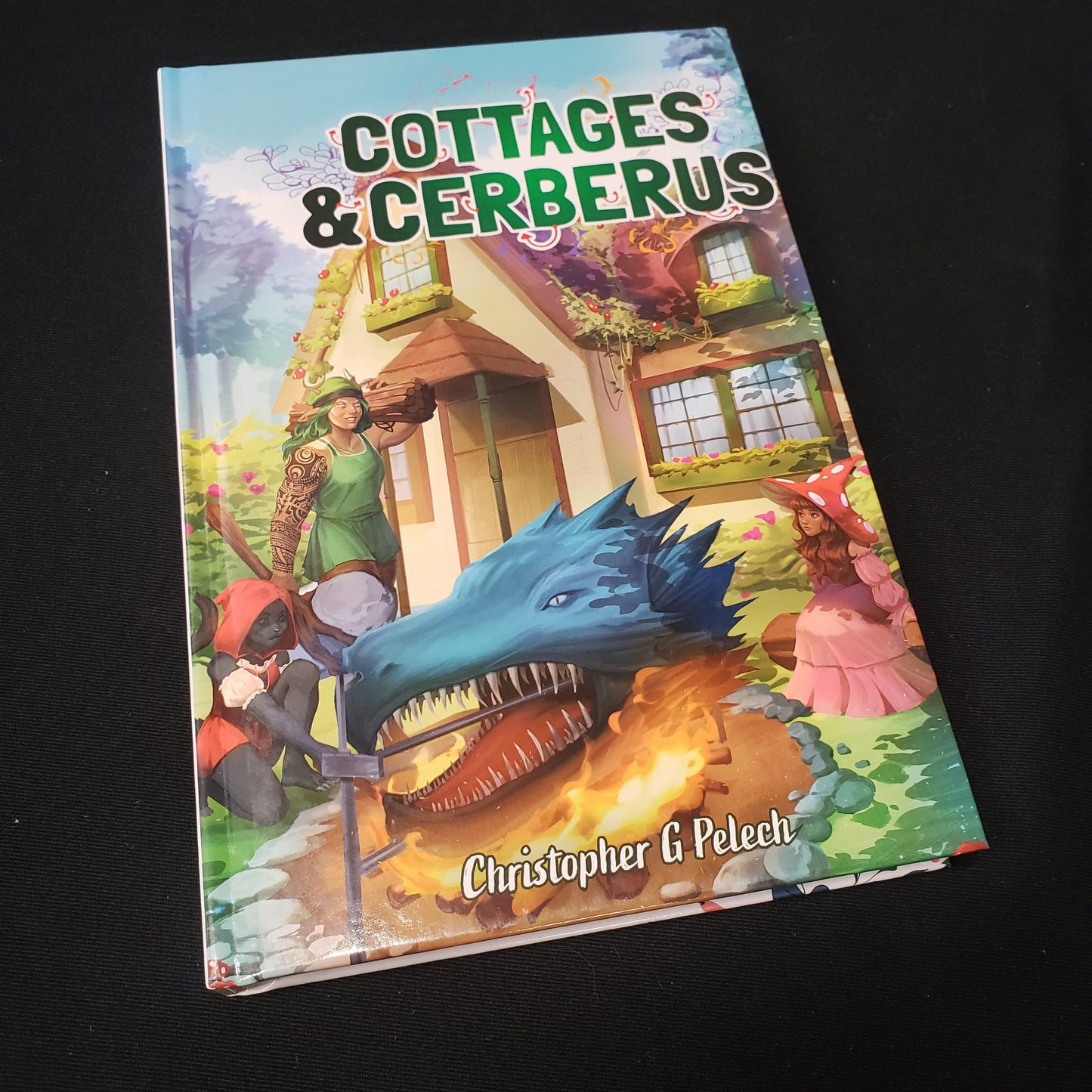 Image shows the front cover of the Cottages & Cerberus roleplaying game book