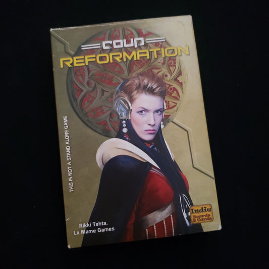 Image shows the front cover of the box of the Reformation expansion for the card game Coup