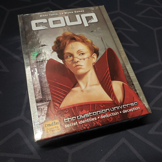 Image shows the front cover of the box of the card game Coup