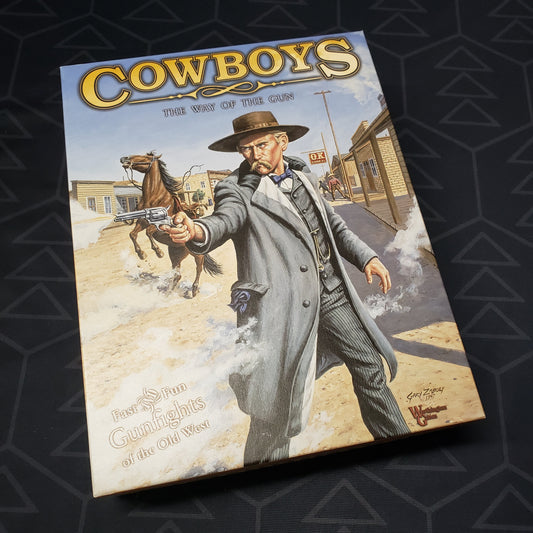 Image shows the front cover of the box of the Cowboys: The Way of the Gun board game
