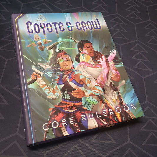 Image shows the front cover of the core rulebook for the roleplaying game Coyote & Crow
