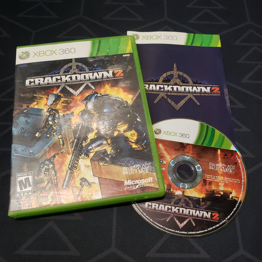 Image shows the case, manual and disc for the video game Crackdown 2 for Xbox 360