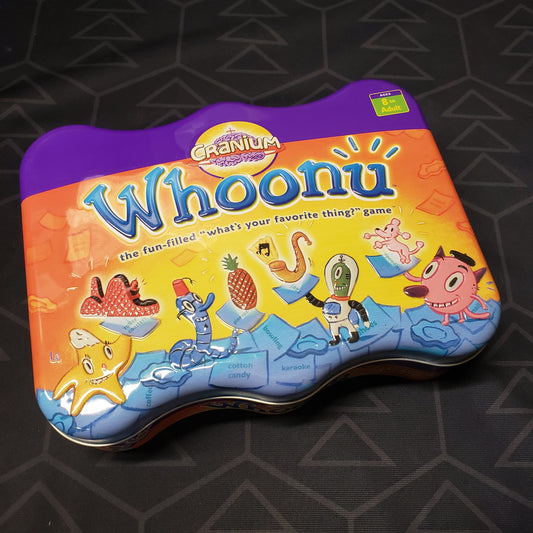 Image shows the front cover of the box for the Cranium Whoonu card game