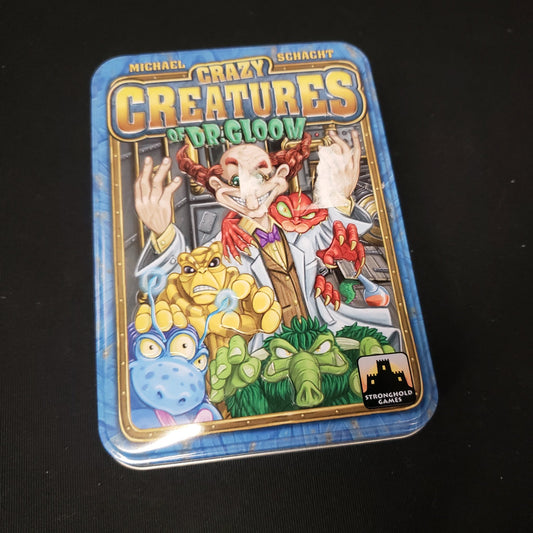 Image shows the front cover of the box of the Crazy Creatures of Dr. Gloom card game