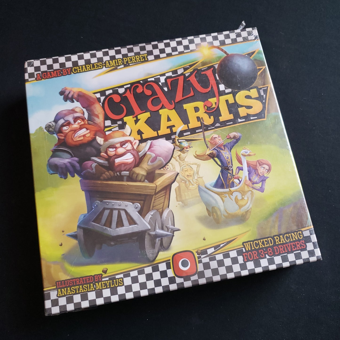 Image shows the front cover of the box of the Crazy Karts board game