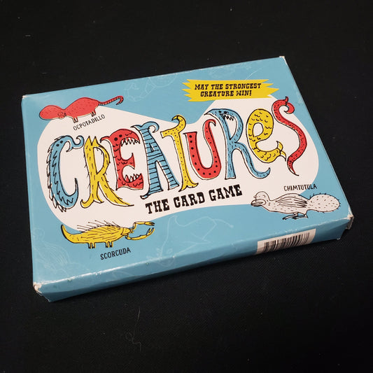 Image shows the front cover of the box of Creatures: The Card Game