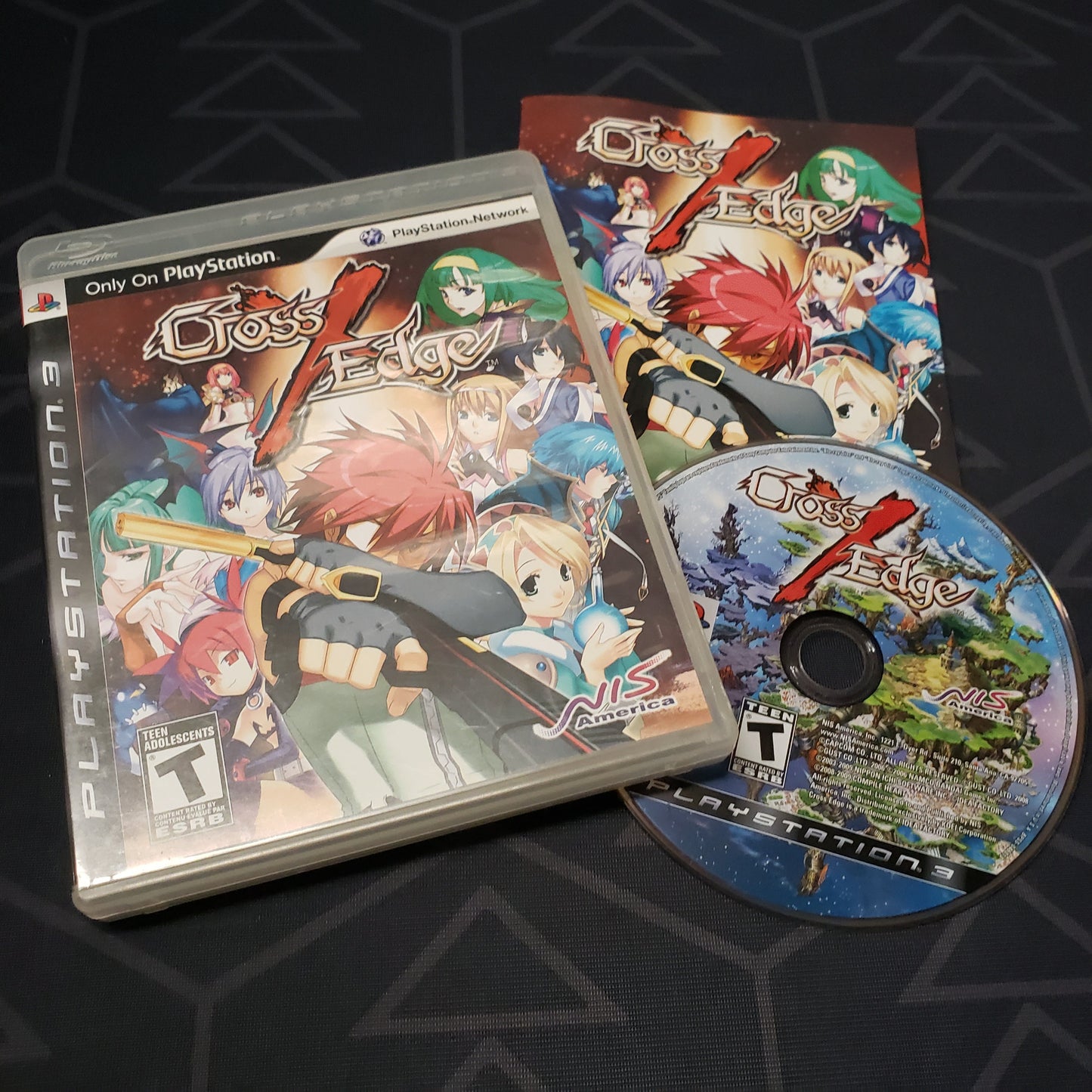 Image shows the case, manual and disc for the video game Cross Edge for Playstation 3